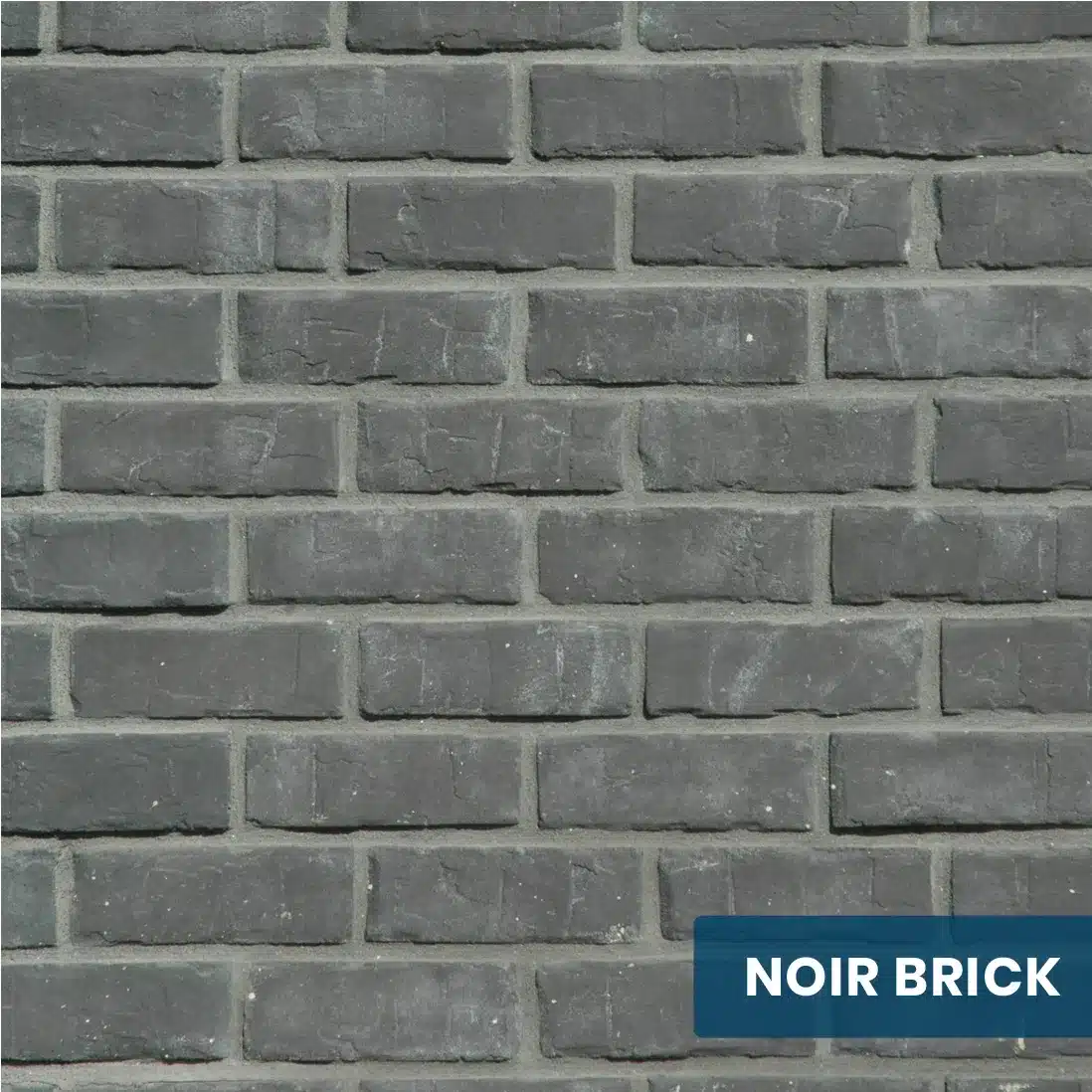 Close-up view of Innovative Stonecraft's Noir Brick pavers, showcasing their sleek and dark design