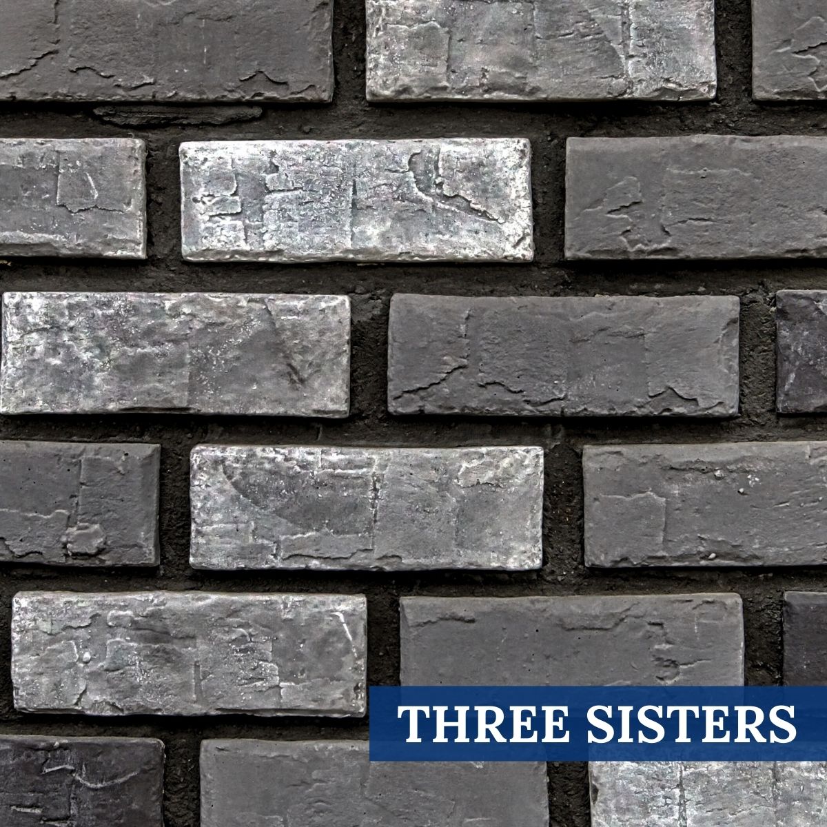 Sample Photo of Innovative Stoncraft's Three Sisters Profile which displays charcoal, grey and white hues. This profile is part of our Brick Collection.